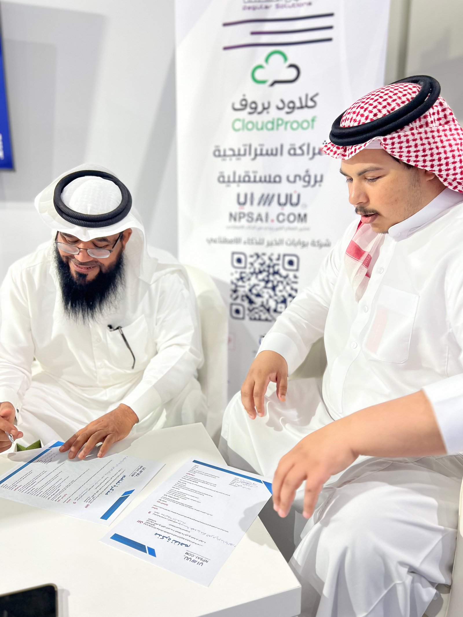 Low angle view up into a sky filled with deep blue clouds. 