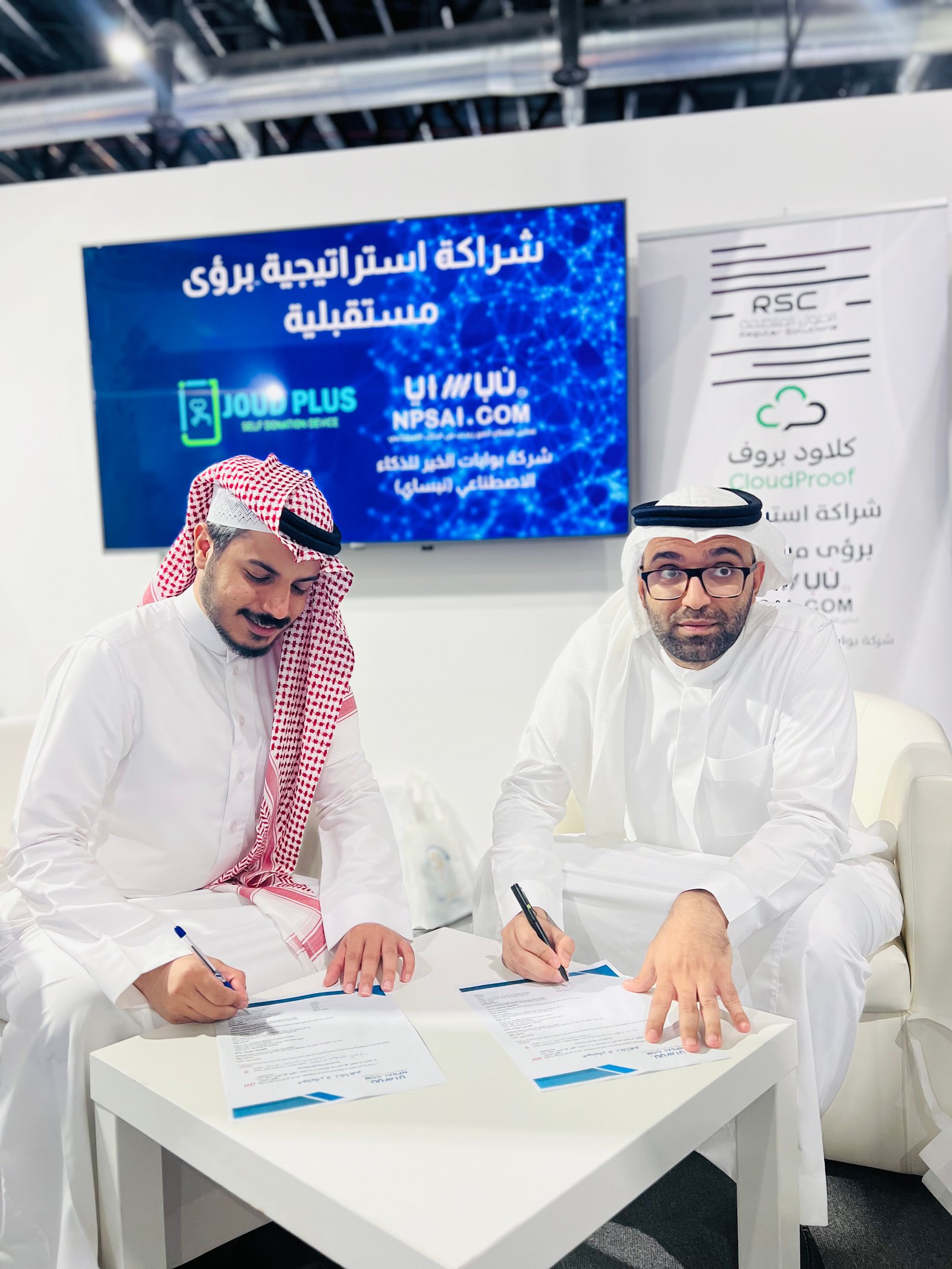Low angle view up into a sky filled with deep blue clouds. 